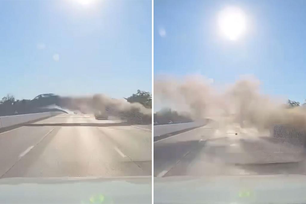A car in the air explodes on 4 lanes of the highway in a crazy video of a smoky wreckage
